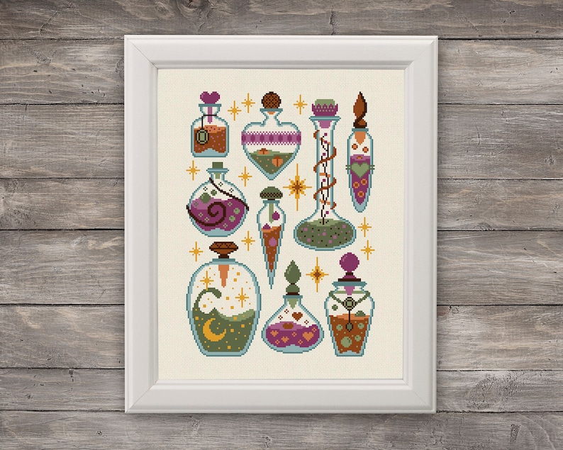 May include: A collection of nine glass bottles with various colored liquids and decorative elements, including hearts, stars, and vines. The bottles are arranged in a symmetrical pattern on a cream-colored background.