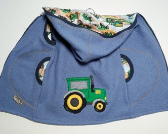 Walk vest in size. 116, wool walk with tractor embroidery in light blue