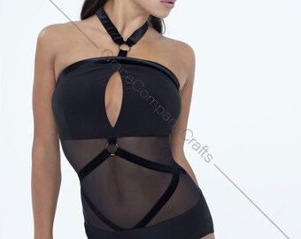 May include: Black mesh bodysuit with velvet straps and a ring detail. The bodysuit has a halter neckline and a low cut.