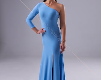 May include: A woman wearing a light blue one-shoulder dress with a long sleeve and a slit in the skirt. She is standing on a grey background.