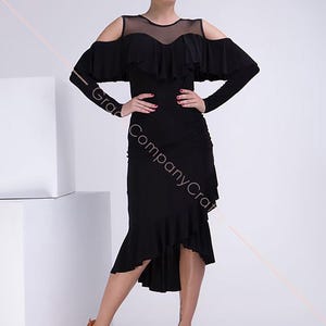 A black, off-the-shoulder, form-fitting dance dress. Long Sleeve Latin Dance Dress