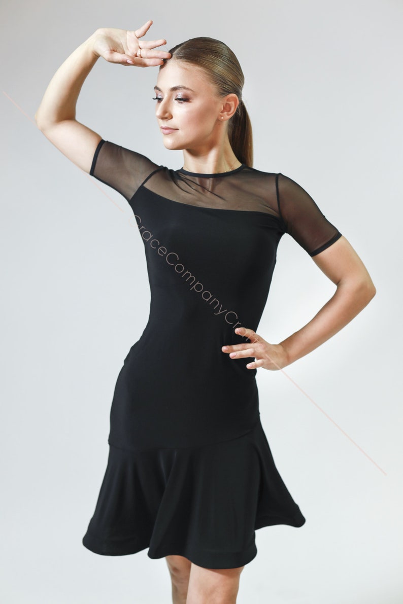 May include: A black dance dress with a mesh top and a flared skirt.