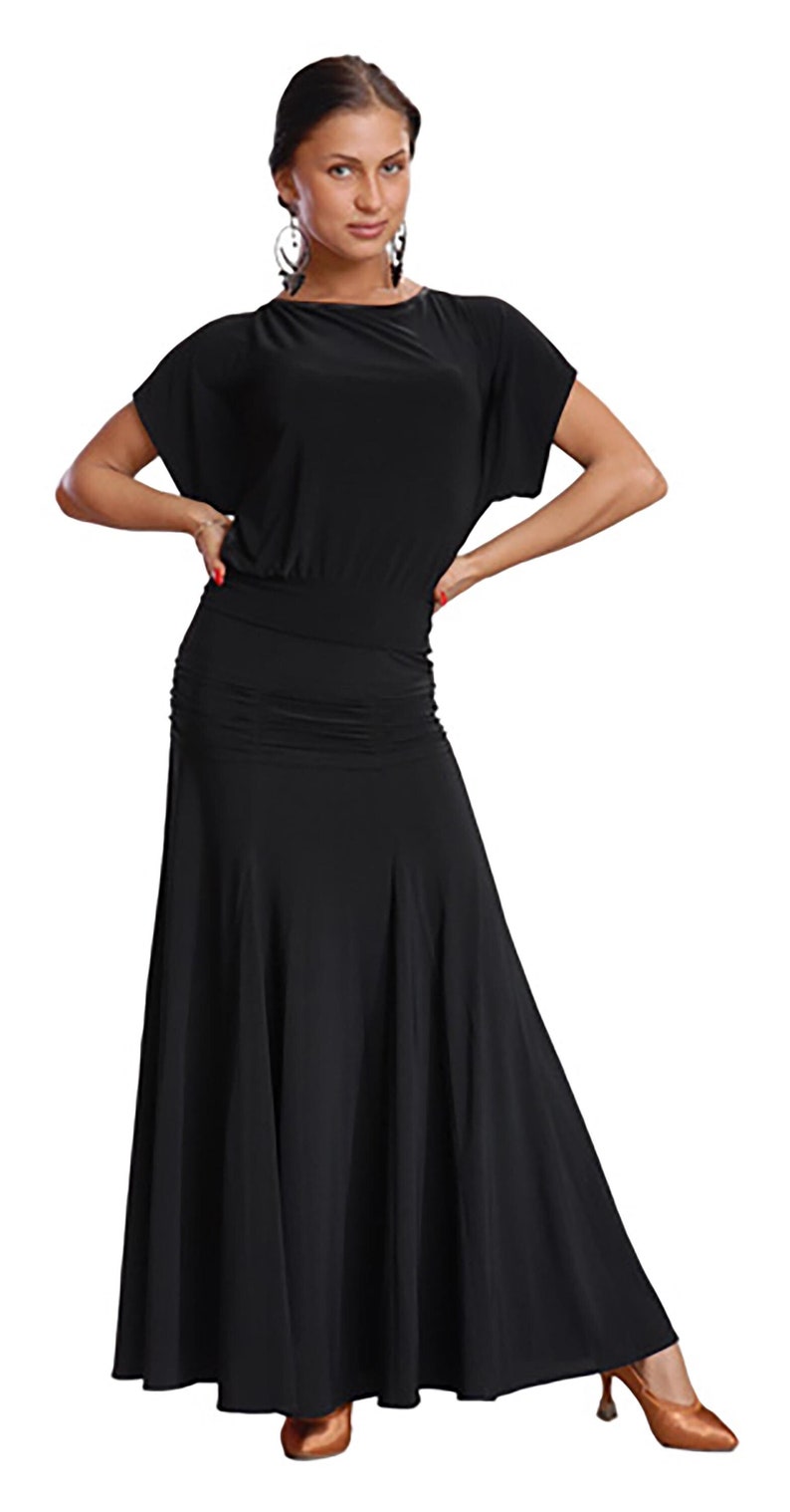 May include: A black dance dress with a fitted bodice and a flowing skirt. The dress has short sleeves and a scoop neckline.