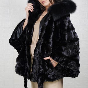 Real mink fur coat for women, offering comfort and elegance for all winter occasions.