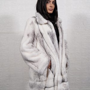 Close up natural black cross mink fur texture real full skin pelts handmade quality soft sheen luxury coat