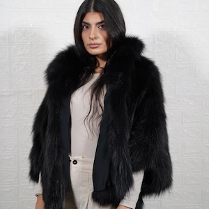 Detailed view of fox fur coat collar and closure, showing artisan craftsmanship and premium fur quality of handmade jacket