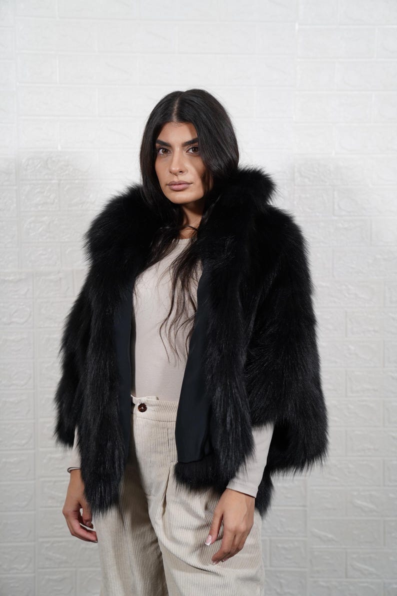 Detailed view of fox fur coat collar and closure, showing artisan craftsmanship and premium fur quality of handmade jacket