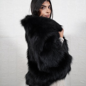 Luxury handmade fox fur coat styled for winter elegance, artisan crafted real fur jacket perfect for formal events and weddings