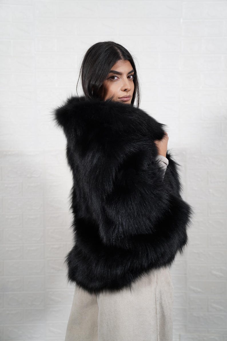 Luxury handmade fox fur coat styled for winter elegance, artisan crafted real fur jacket perfect for formal events and weddings