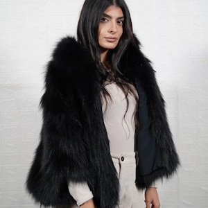 Back view of handmade fox fur coat showing premium fur quality and full length design, luxury women's winter outerwear