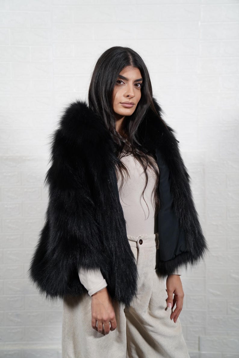 Back view of handmade fox fur coat showing premium fur quality and full length design, luxury women's winter outerwear
