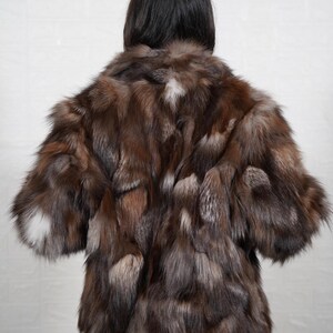 Back view of handmade fox fur coat showing premium fur quality and full length design, luxury women's winter outerwear