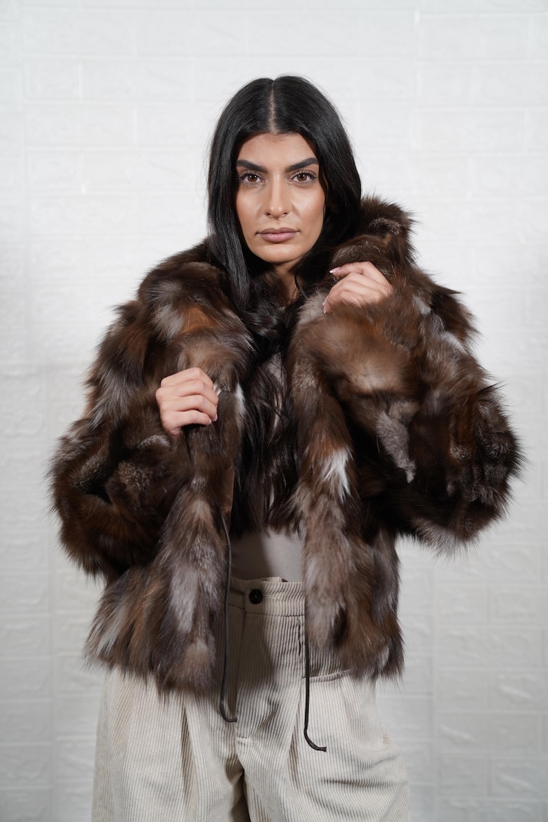 Luxury handmade fox fur coat styled for winter elegance, artisan crafted real fur jacket perfect for formal events and weddings