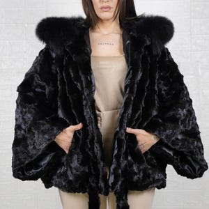 Sophisticated mink fur coat designed for women who appreciate luxury, comfort, and warmth.