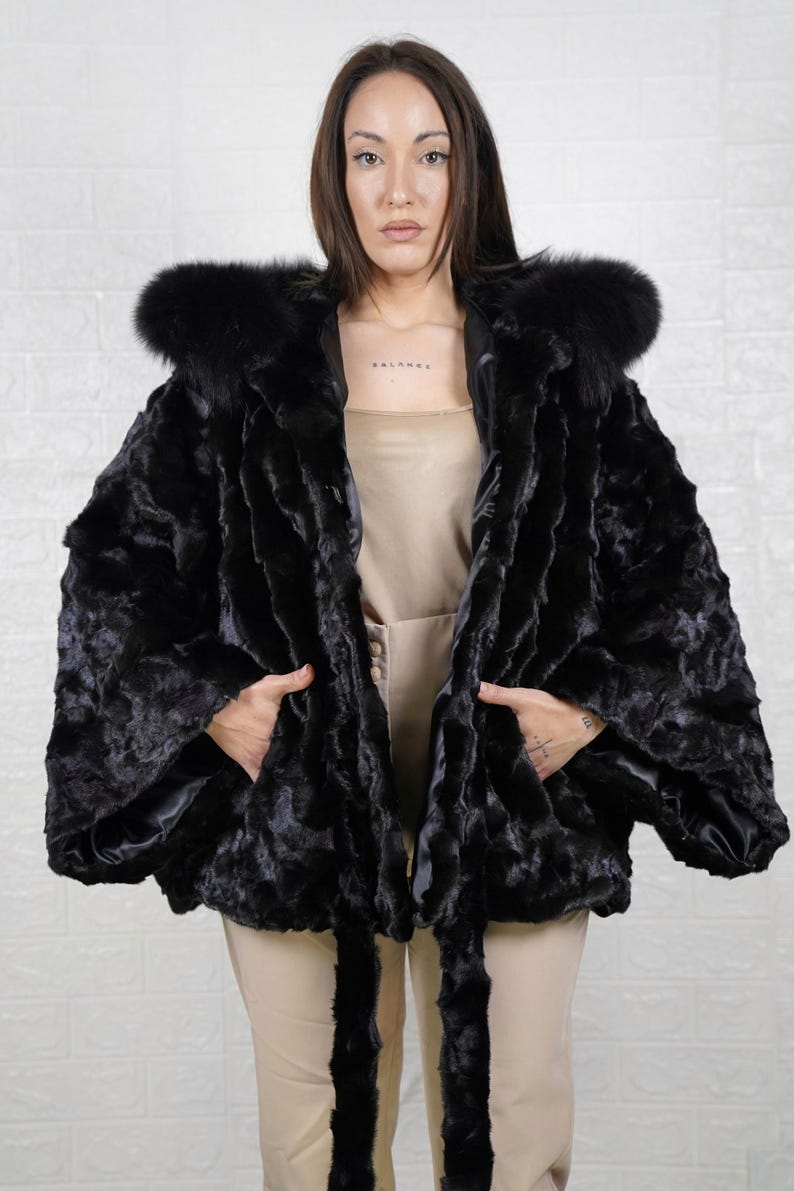 Sophisticated mink fur coat designed for women who appreciate luxury, comfort, and warmth.