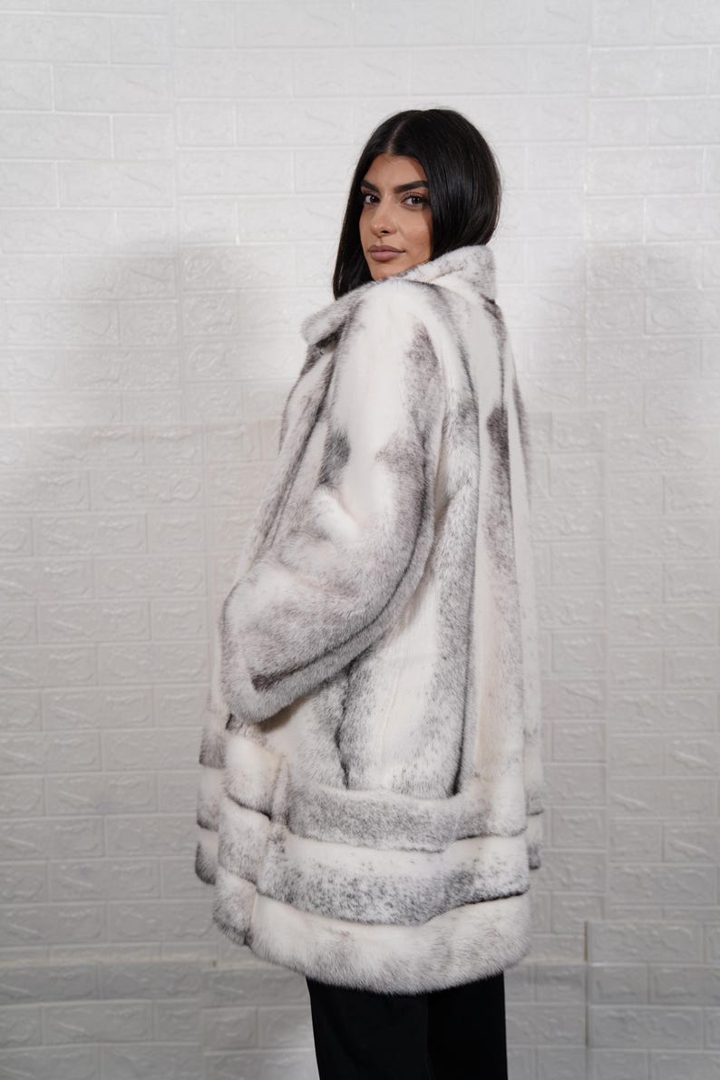 Side profile natural black cross mink fur overcoat long length elegant silhouette luxury women coat pockets