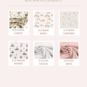 May include: A color selection chart for cotton jersey fabric featuring six swatches labeled 10 through 15. Patterns include farm life, rainbows, leopard print, mice, solid natural white, and solid rose pink, all displayed on a light pink background.