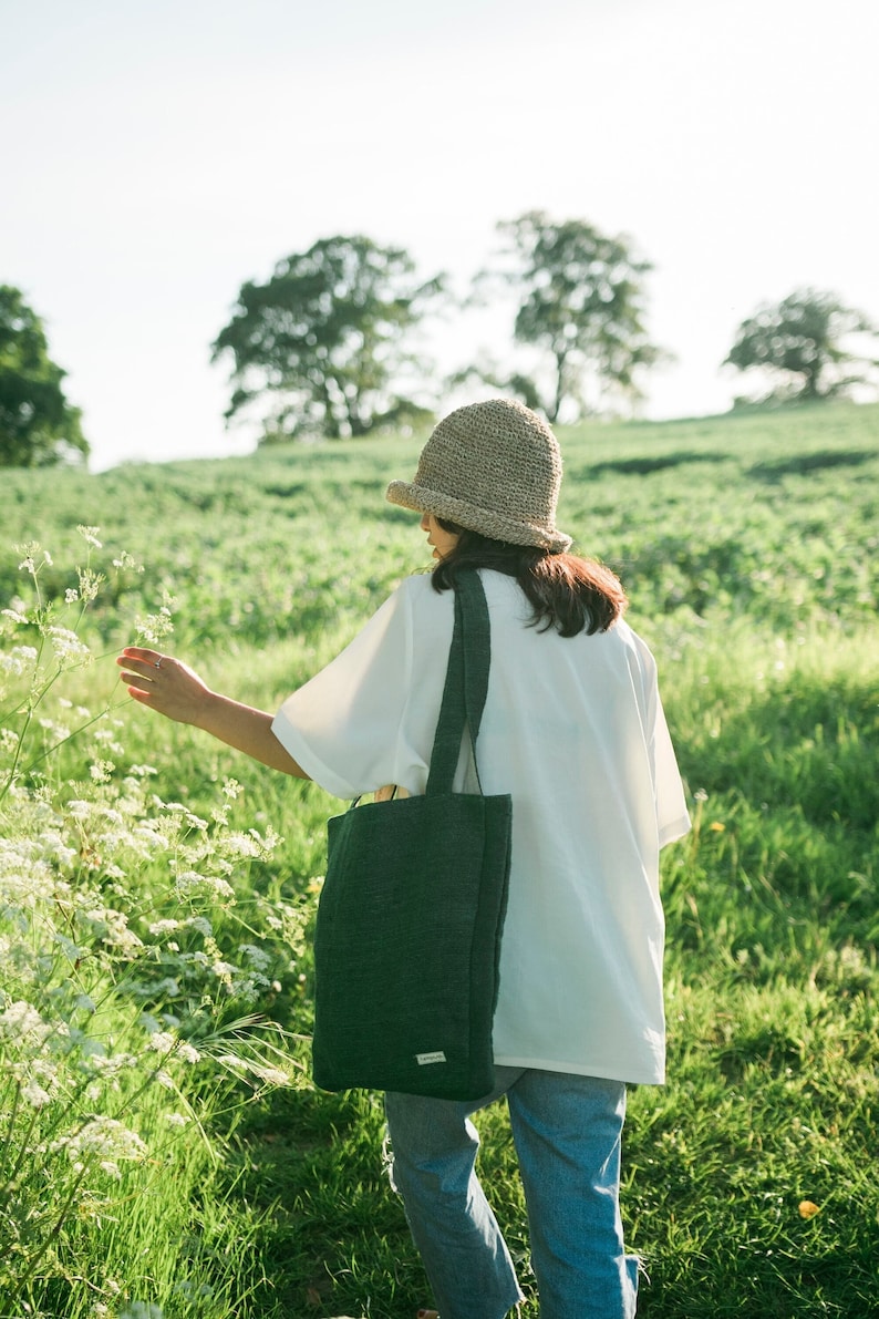 Eco-friendly tote bag made from pure hemp and cotton, handcrafted in Nepal. Features a spacious main compartment and an inner pocket