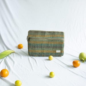 Hemp laptop sleeve featured in a modern workspace, showcasing its stylish and functional design perfect for sustainable, everyday use.