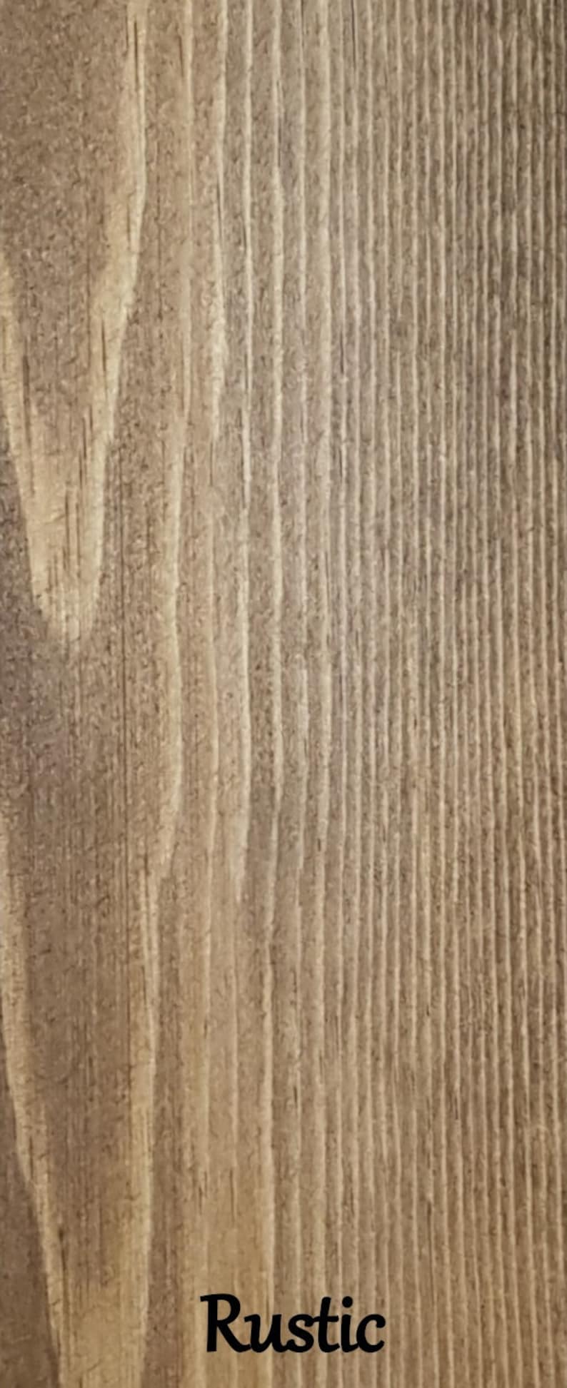 May include: Close-up of a rustic wood grain texture with the word "Rustic" printed in black at the bottom.
