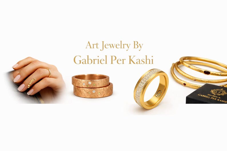 May include: An assortment of gold jewelry, including rings and bangles. One ring is encrusted with small diamonds. The image also features a hand wearing a delicate gold ring and a stack of gold rings. The brand name "Art Jewelry By Gabriel Per Kashi" is displayed.