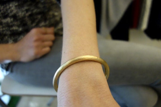 This Gold Bangle Bracelet Is Too Irresistible to Keep Hidden