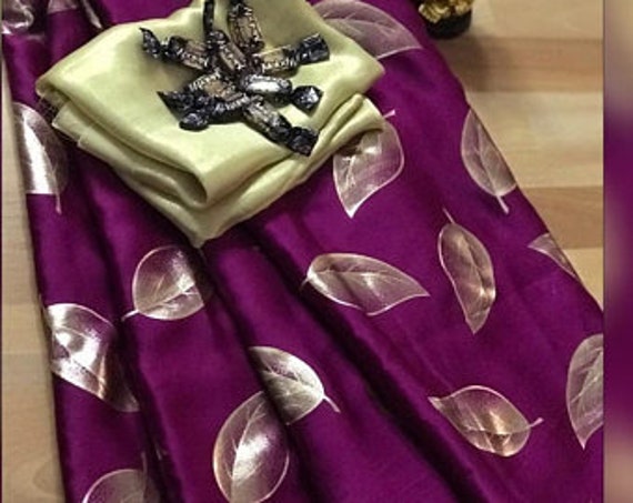 golden blouse with purple saree