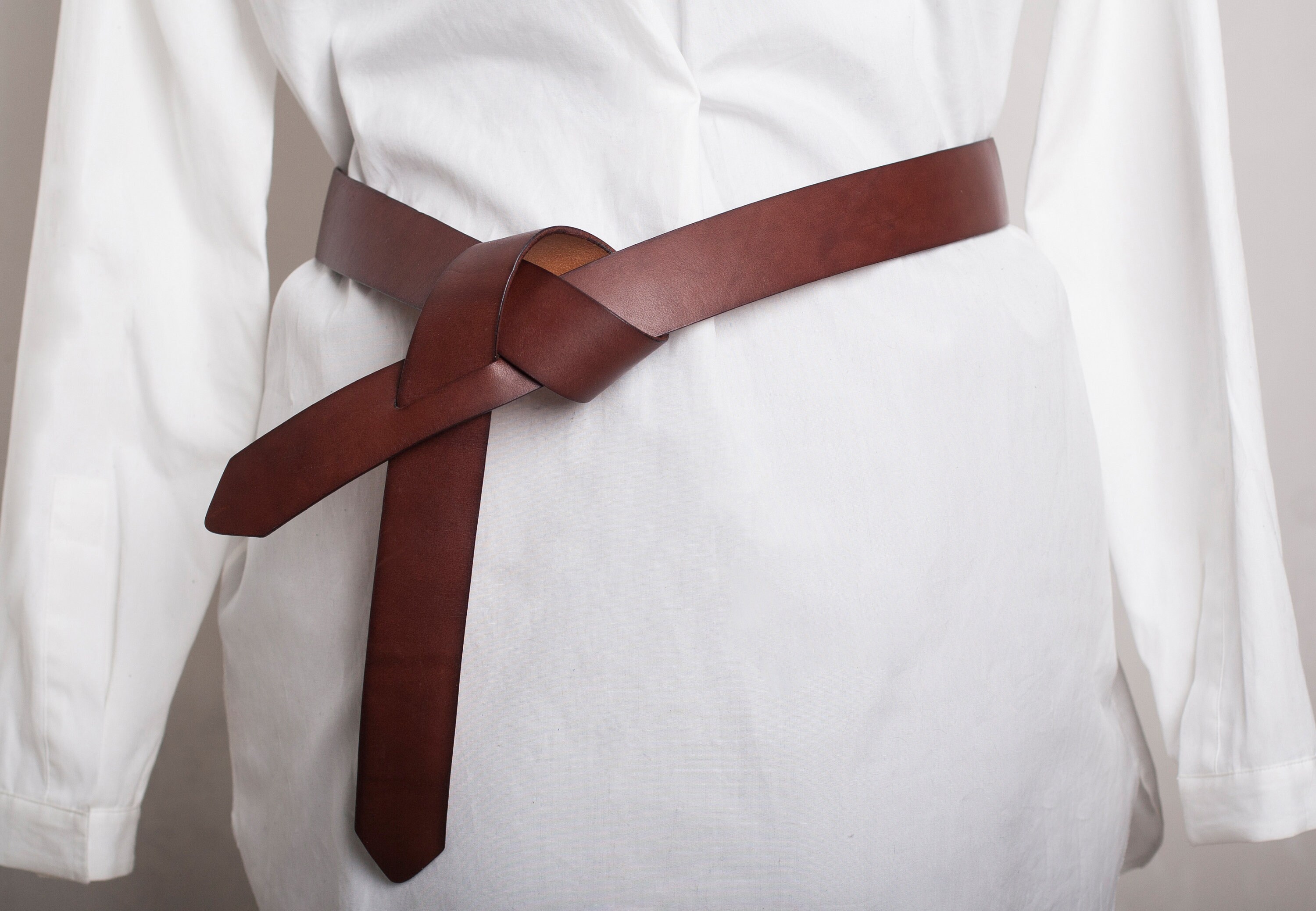 A belt that ties in a knot. Leather belt women minimalist style