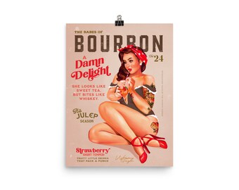 May include: A vintage-style poster advertising bourbon with a pin-up girl illustration. The poster features the text "The Babes of Bourbon", "A Damn Delight", "She looks like sweet tea, but bites like whiskey", "It's Julep Season", and "Strawberry Short Temper - Fruity little drinks that pack a punch".