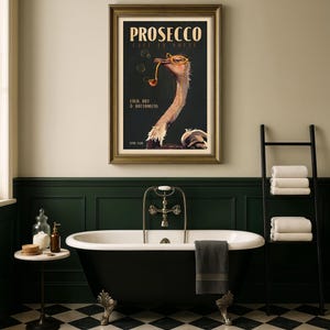 May include: A framed wall art print featuring an ostrich wearing yellow glasses and holding a pipe. The text reads PROSECCO, CAFE EN NOTTE, COLD, DRY & BOTTOMLESS, and 7PM-1AM. The ostrich is set against a dark background with floating bubbles.