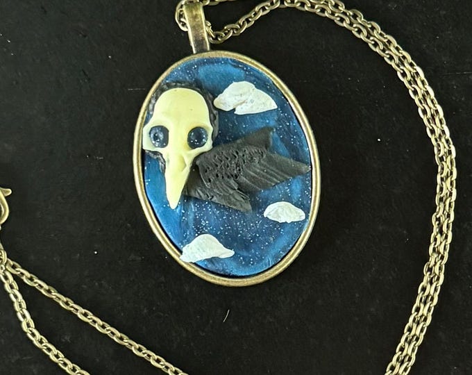 Glow in the dark skull crow necklace