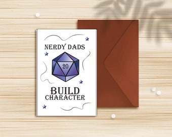 May include: A white card with black text that reads "Nerdy Dads Build Character". A blue and purple 20-sided die is in the center of the card.