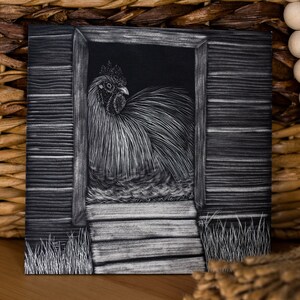 May include: A black and white drawing of a rooster in a coop. The rooster is facing to the left and has a large, fluffy tail. The coop is made of wood and has a small door. The drawing is done in a realistic style.