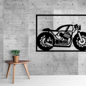 Puede incluir: Silueta en blanco y negro de una motocicleta sobre un fondo de pared de hormigón gris.