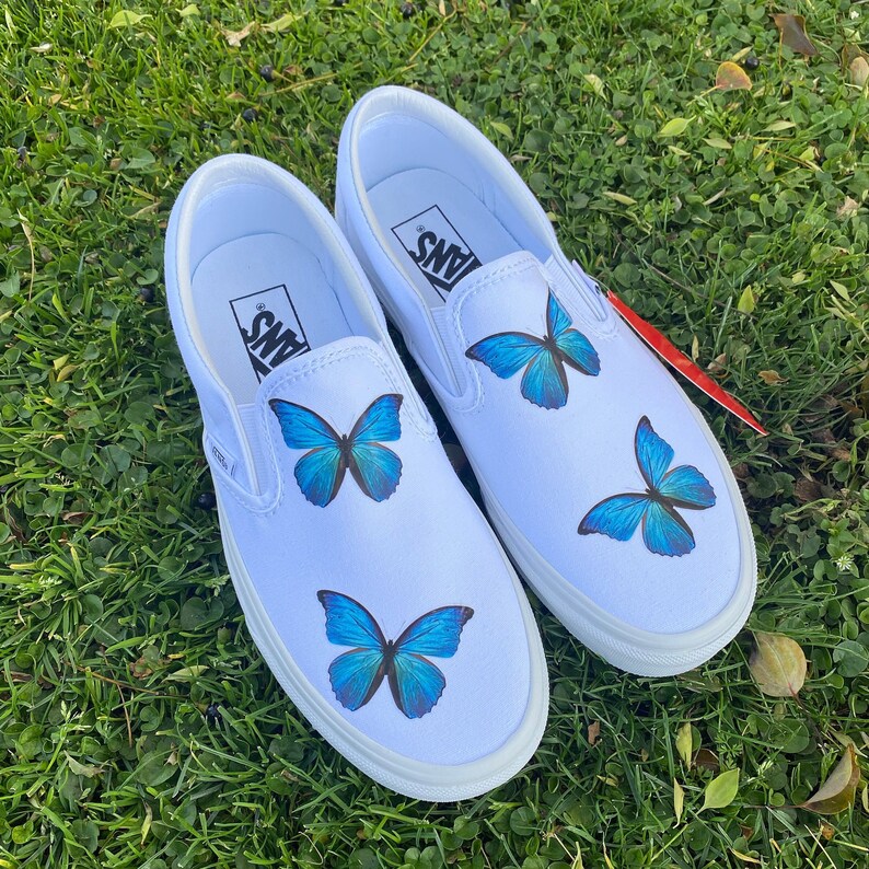 blue butterfly slip on vans