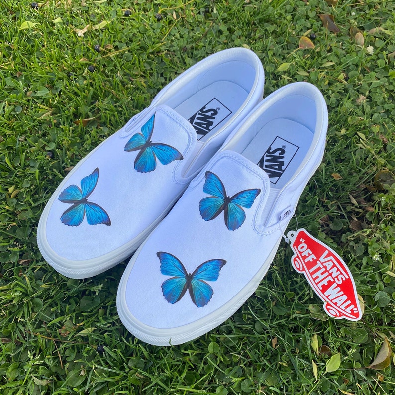 blue butterfly slip on vans