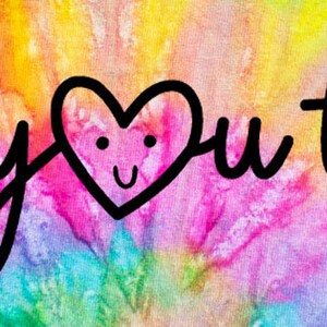 May include: A colorful tie-dye background with the text "Be you tiful" written in black cursive. A heart with a smiling face is in the middle of the text.