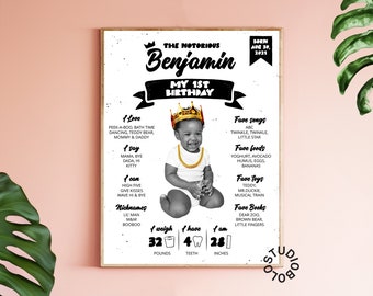 May include: Black and white first birthday poster with a photo of a baby boy wearing a gold crown. The poster includes the baby's name, "Benjamin", and details about his first year, including his weight, height, and favorite things. The poster has a black and white grunge background.