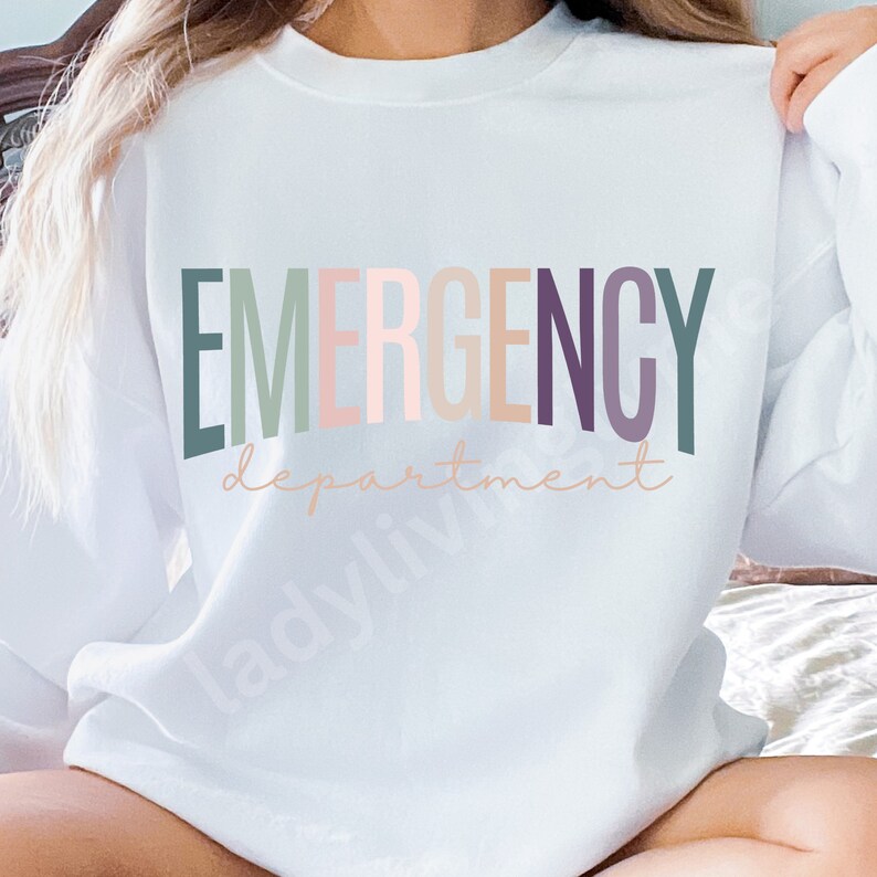 May include: White sweatshirt with the text "EMERGENCY department" in rainbow colors.