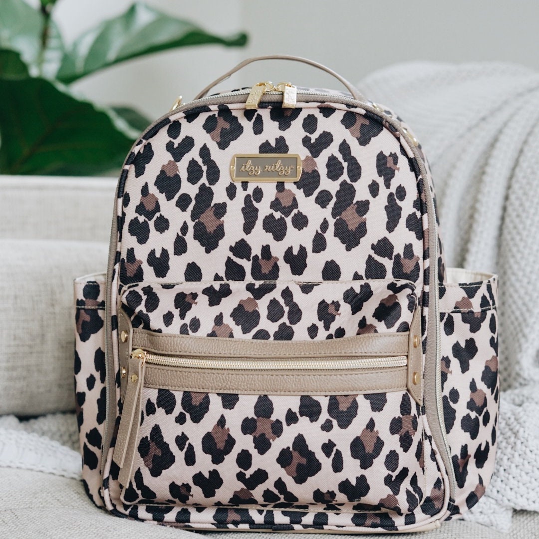 itzy ritzy mini diaper bolsa leopard