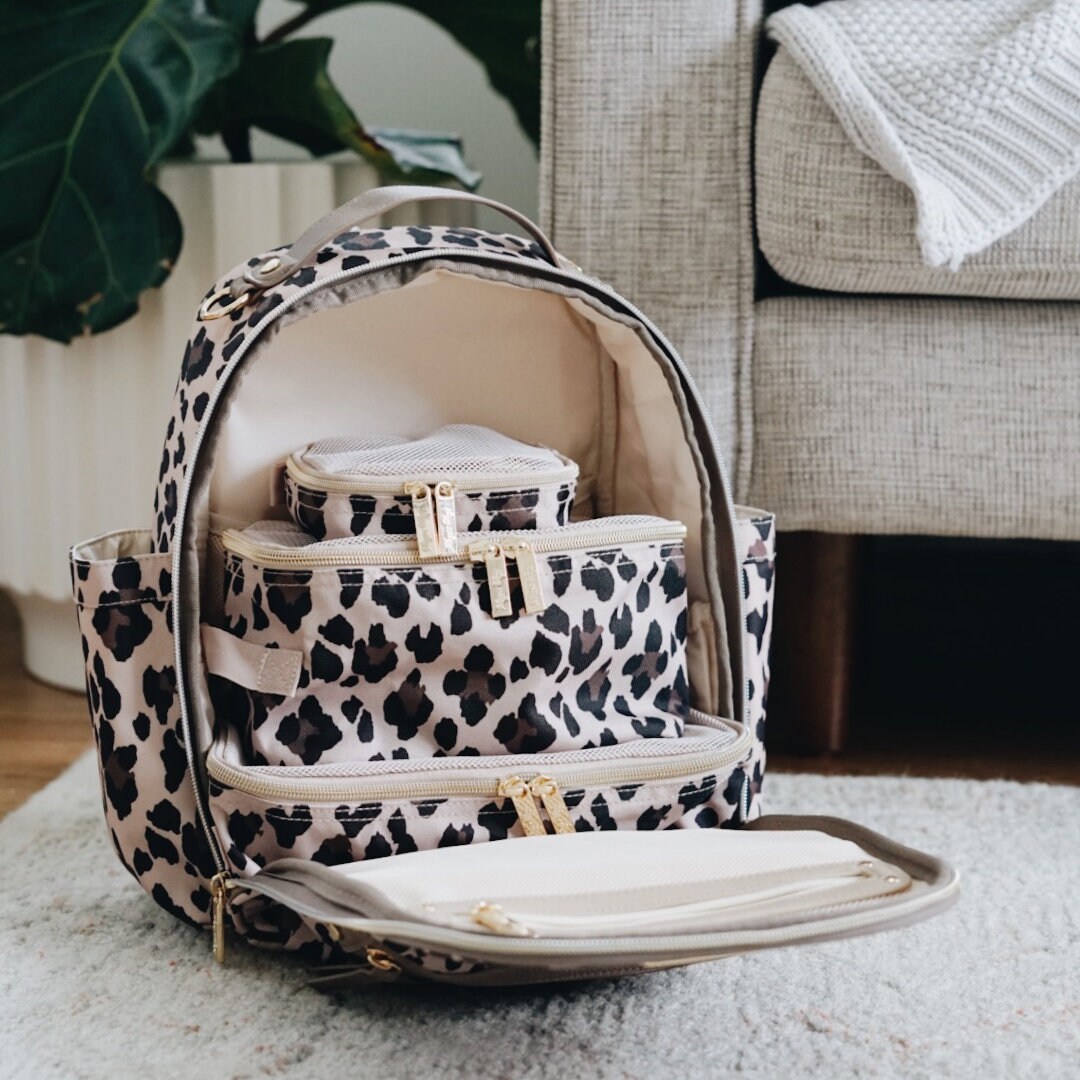 itzy ritzy mini diaper bolsa leopard