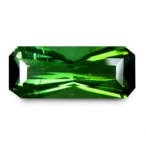 May include: A vibrant green gemstone with a rectangular shape and a faceted cut.
