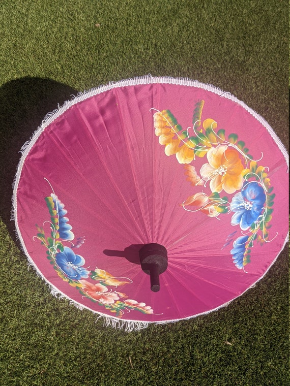 Compact pink parasol with tassels and brightly pa… - image 3