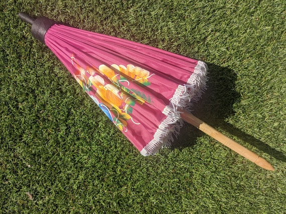 Compact pink parasol with tassels and brightly pa… - image 10