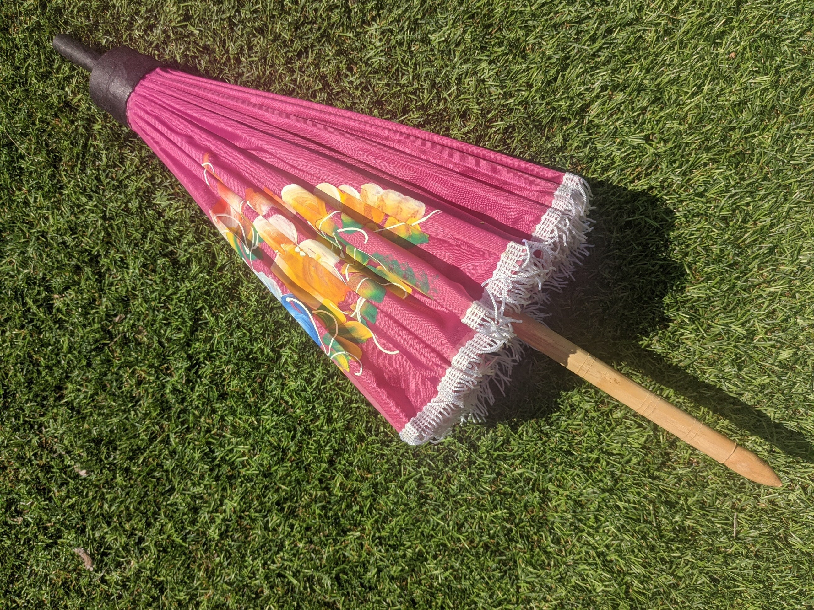 Compact Pink Parasol With Tassels and Brightly Painted