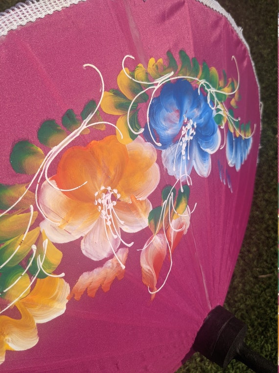 Compact pink parasol with tassels and brightly pa… - image 5