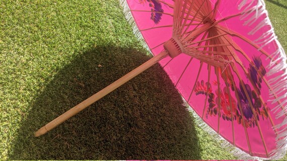 Compact pink parasol with tassels and brightly pa… - image 2