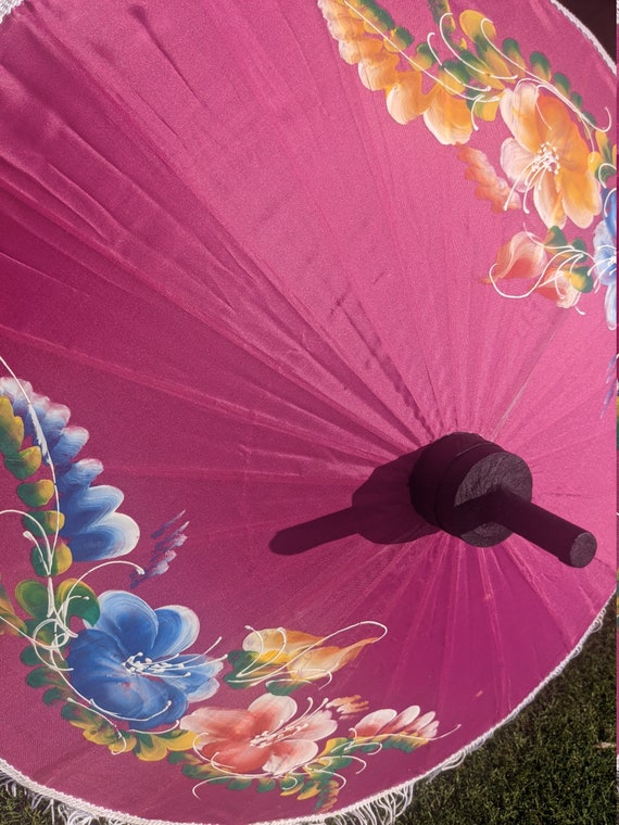 Compact pink parasol with tassels and brightly pa… - image 6