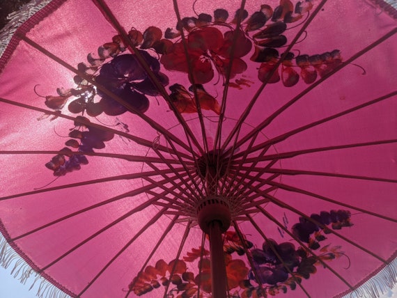 Compact pink parasol with tassels and brightly pa… - image 9