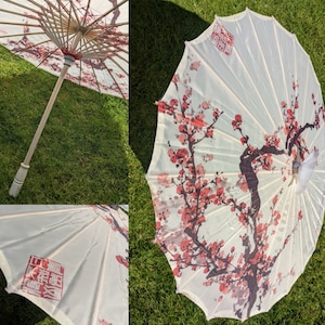 Cream white parasol umbrella with branch of red salmon blossoms 1950s 1960s rockabilly pin-up hot rod wedding photoshoot Japanese Chinese